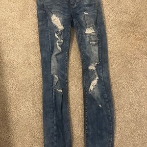 Dark blue low rise ripped skinny jeans